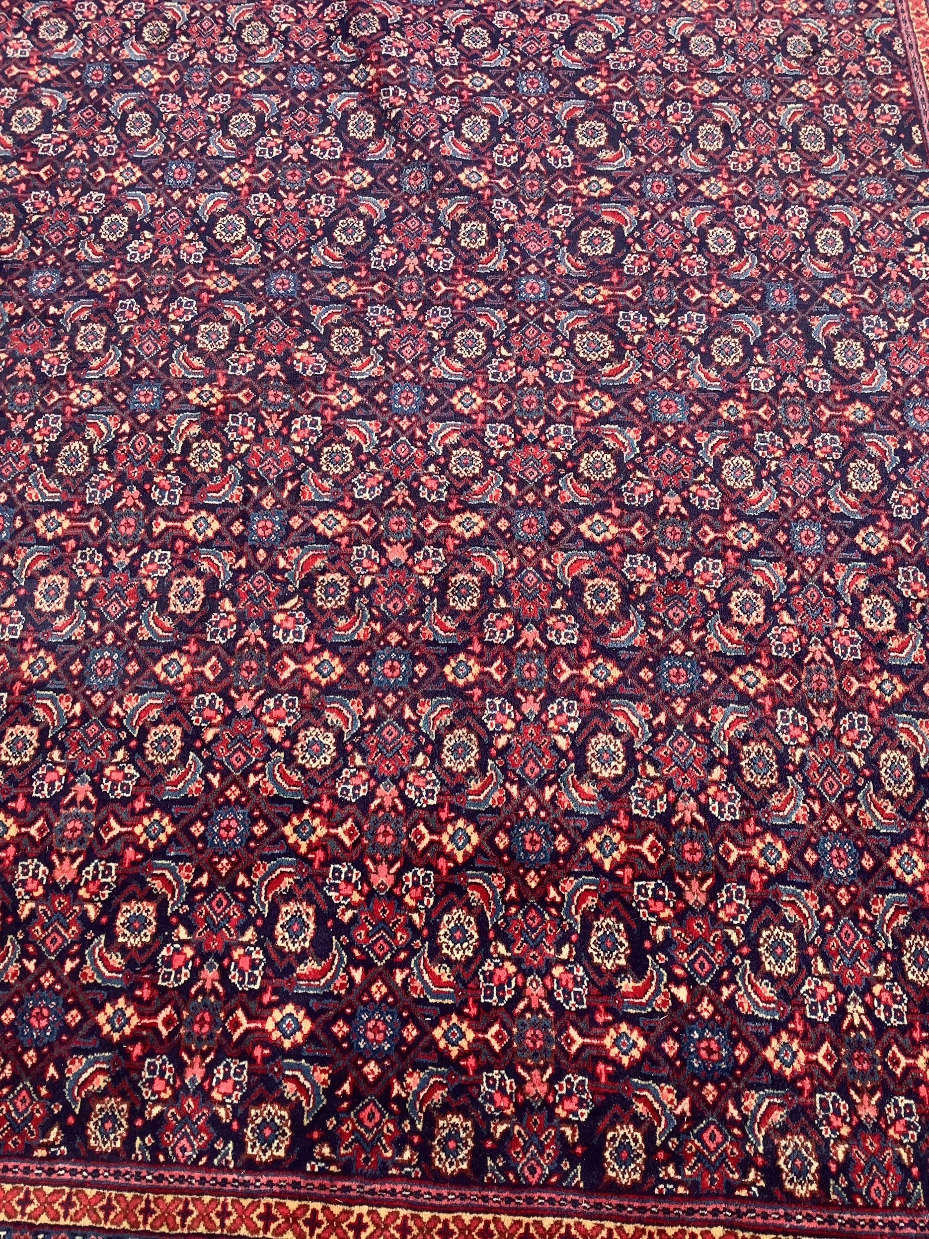 A North West Persian blue ground carpet, 534 x 325cm